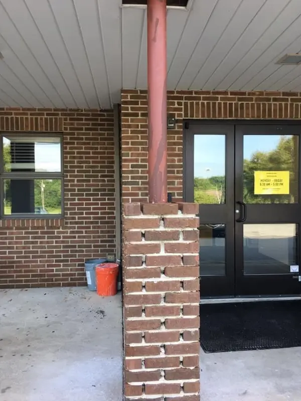 Brick column repair at a covered entry