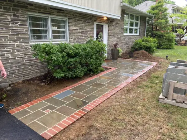 Stone walkway with brick border