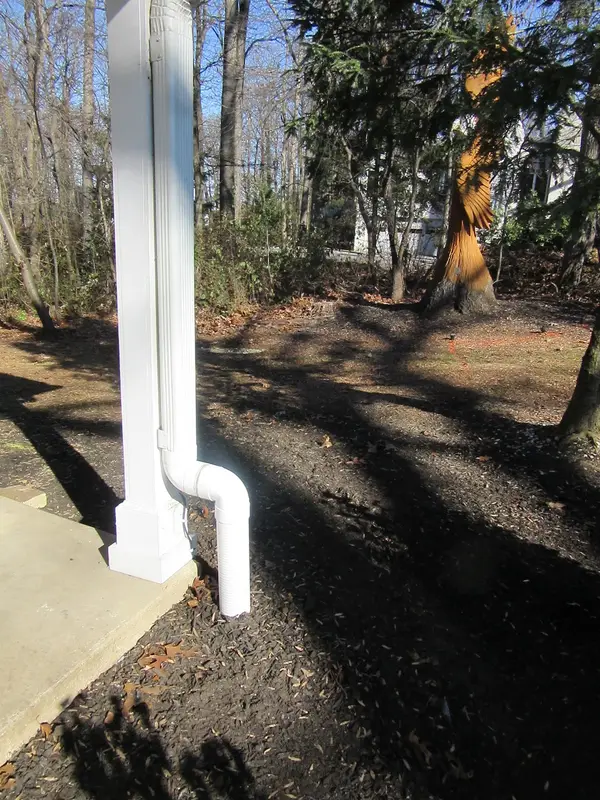 Buried downspout and exterior drainage work