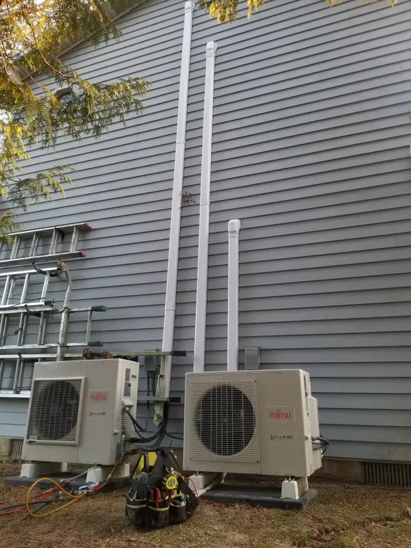 Two ductless outdoor units during service