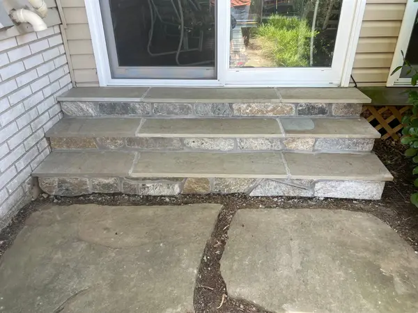 Rebuilt stone front steps at a home
