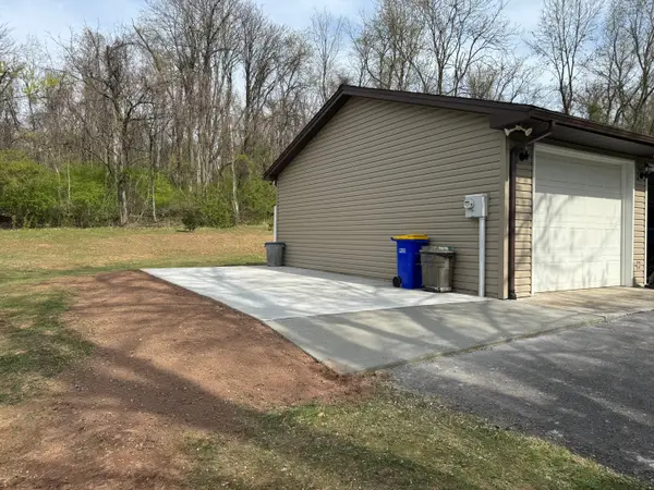 Concrete drive beside a detached garage