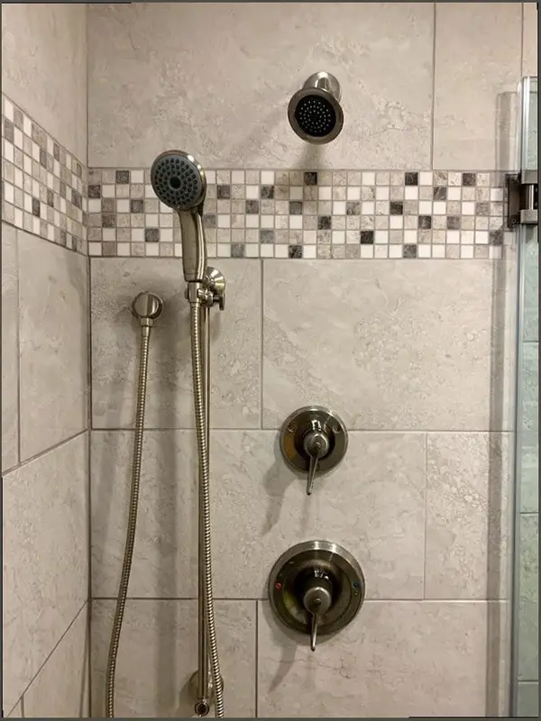 Finished shower fixture and tile work by Bradley’s Plumbing & Water Heaters