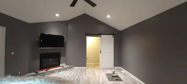 Finished living room with ceiling lighting