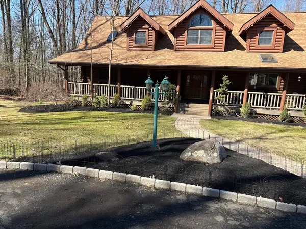 Mulched beds at a log home