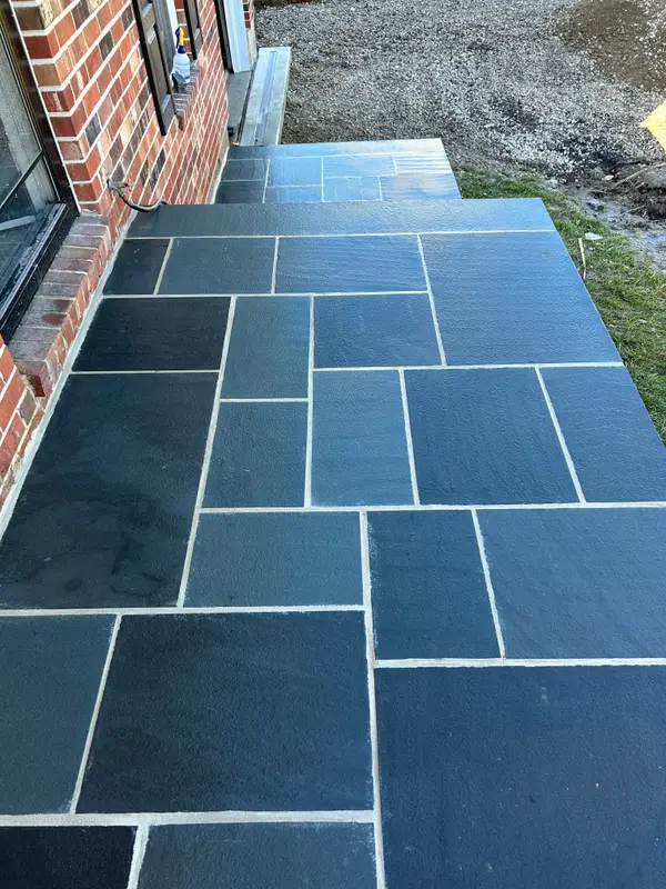 Blue-gray flagstone steps at a residential entrance