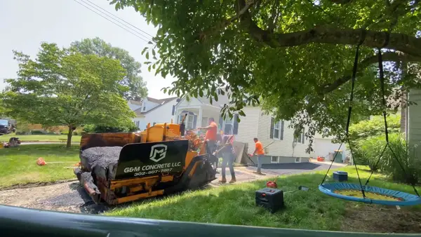 G and M branded paving equipment and crew