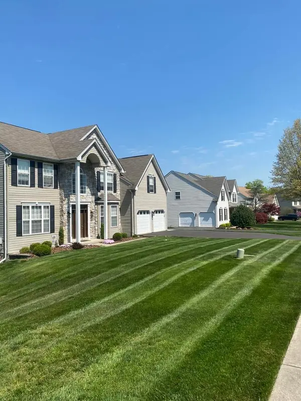 Mowed lawn along a row of homes
