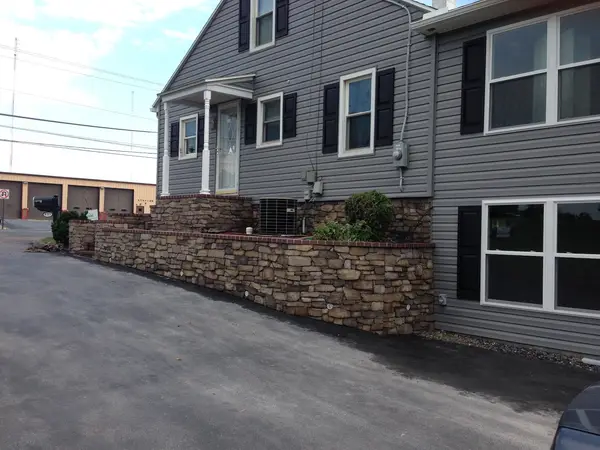 Stone wall beside a home
