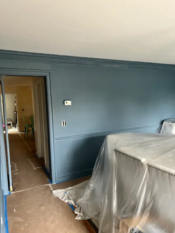 Wall painting with furniture protected
