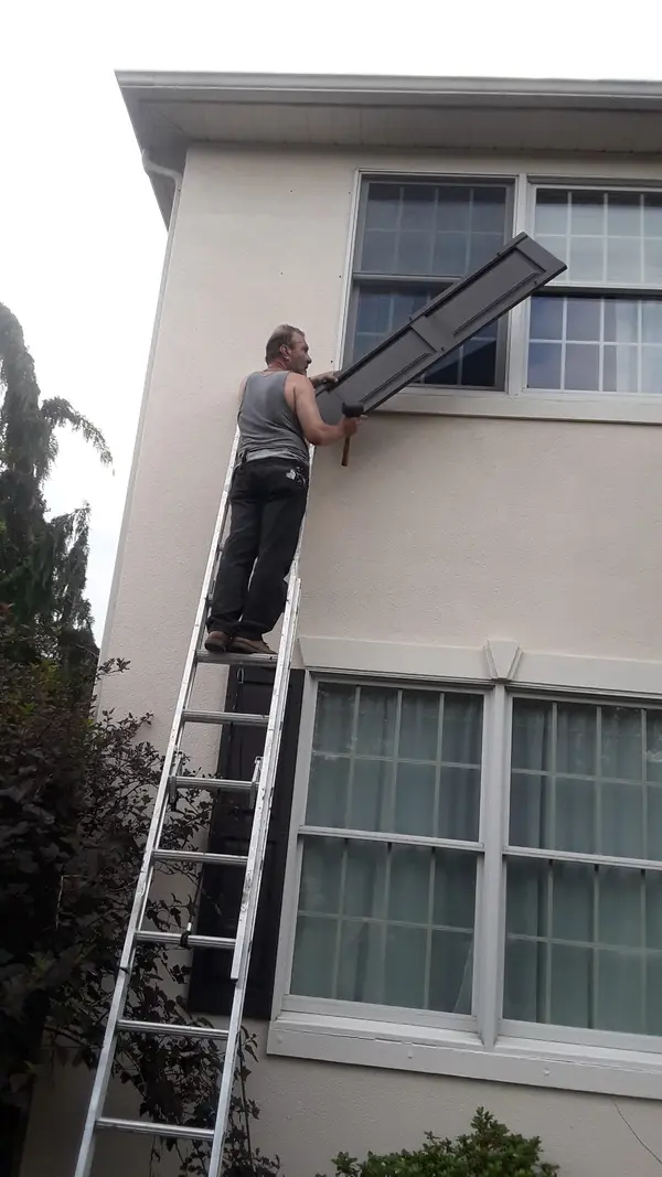 Exterior trim work from a ladder