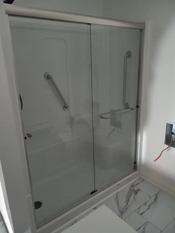 Glass shower enclosure