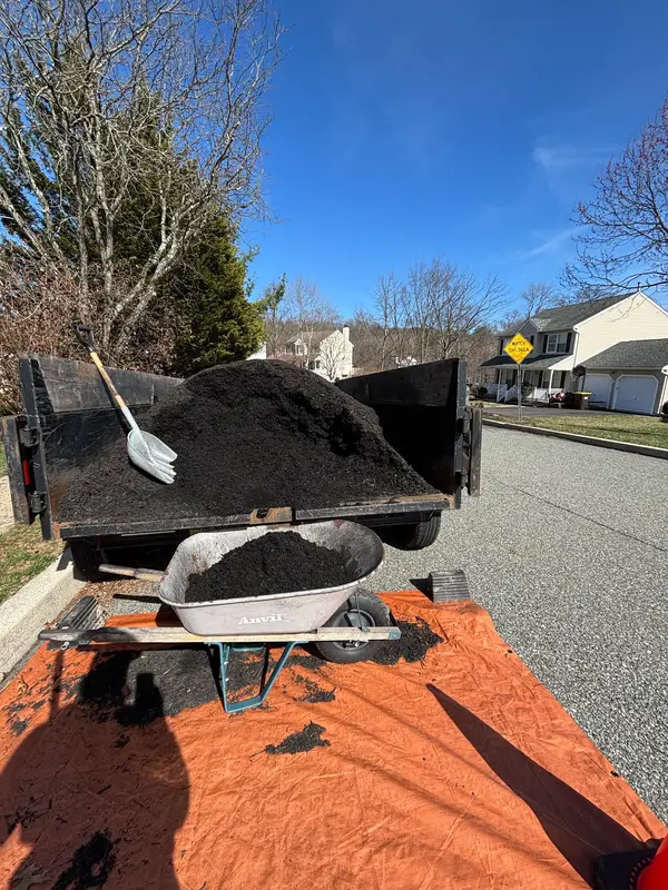 Mulch and wheelbarrow at a job