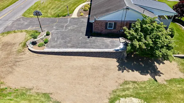 Aerial view of driveway-side landscaping
