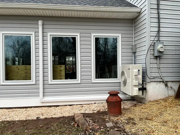 Ductless equipment installed along a house