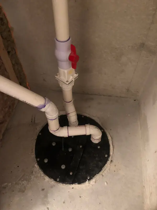 Sump pump and discharge piping