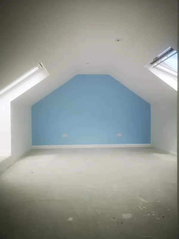 Attic room with accent wall