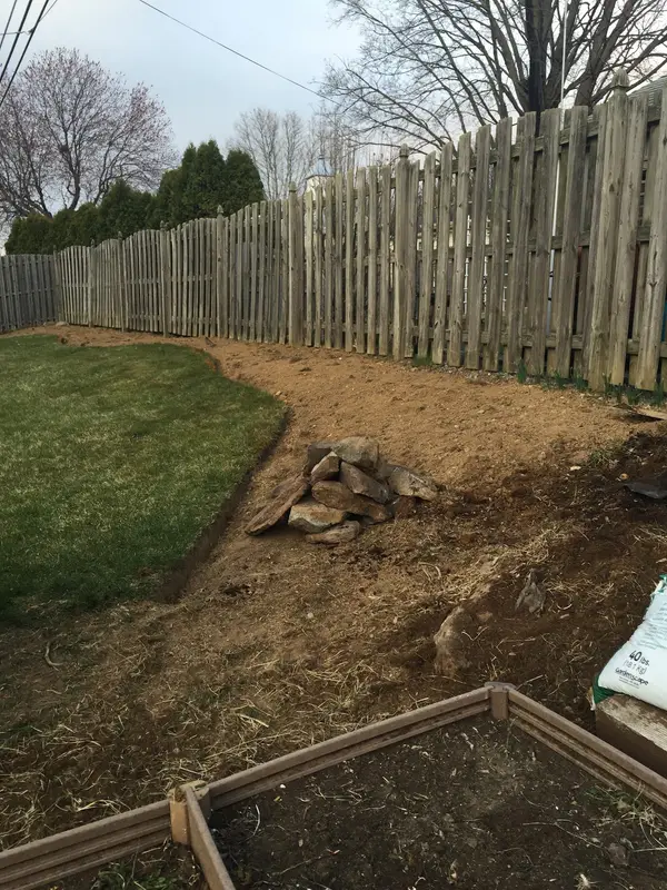 Bed preparation beside a fence