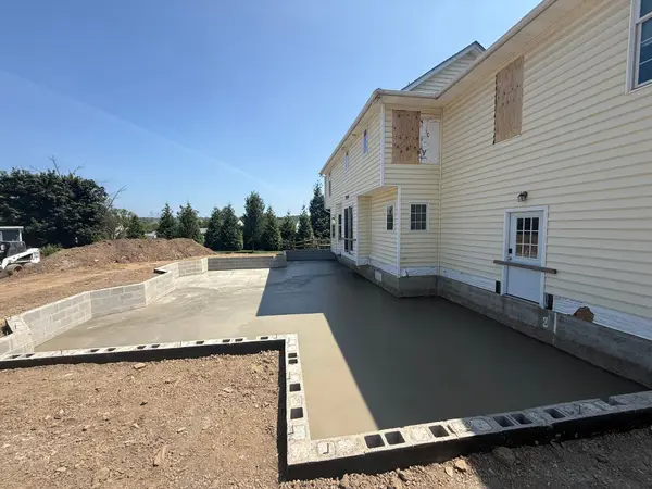 Large finished patio by First Class Concrete