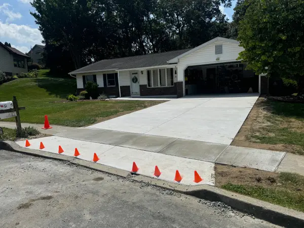 Finished concrete driveway and sidewalk at a home
