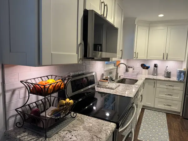 Kitchen and island shown on the Joshua Myers profile