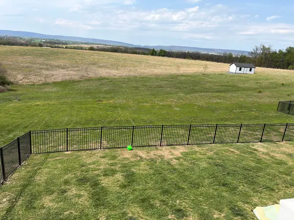 Long black ornamental fence around a property