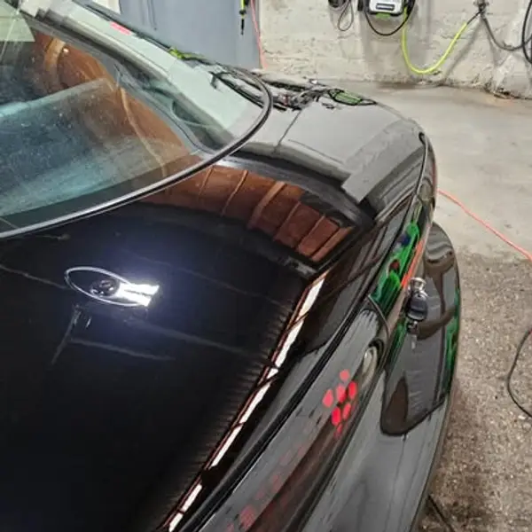 Glossy dark vehicle paint after correction work by JRC Shine