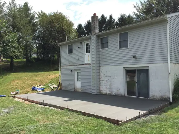 Crew placing concrete for a patio