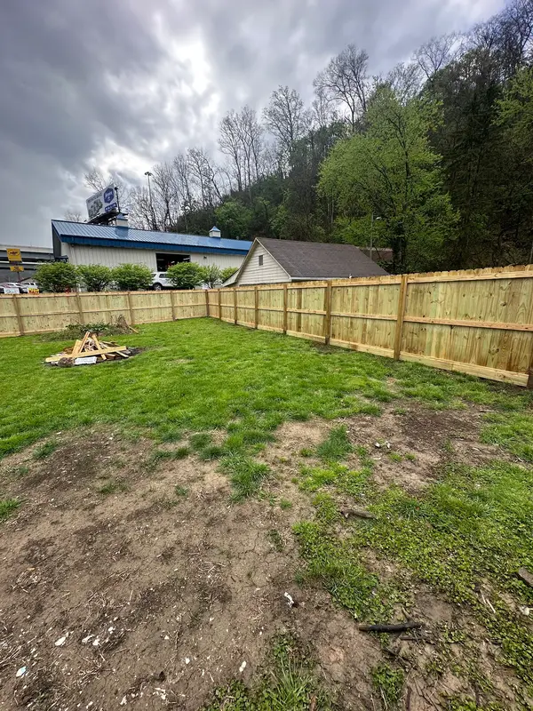 Wood privacy fence around a backyard