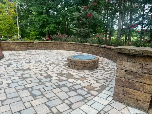 Paver patio with a circular fire feature