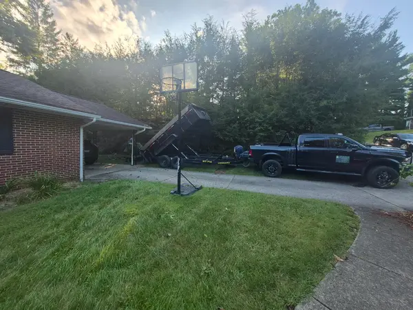 Tree equipment beside a residential driveway