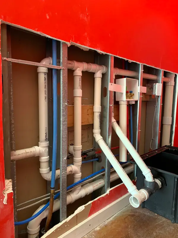 Supply and drain lines in an open wall