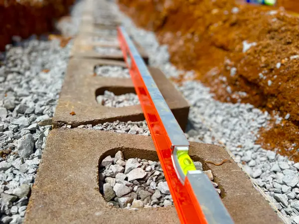 Retaining wall blocks during installation