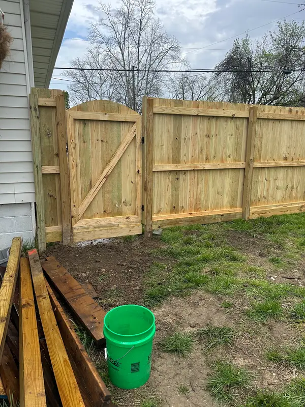 Wood gate beside a house