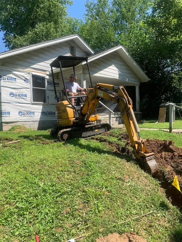 Excavation beside a house