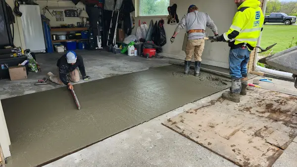 Crew finishing a garage floor