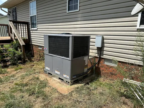 HVAC unit beside a deck