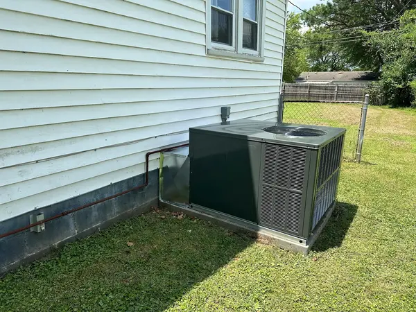Outdoor condenser on a concrete base
