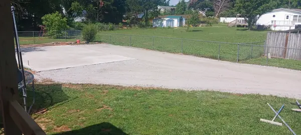 Concrete driveway across a yard