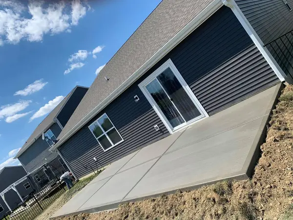 Concrete slab beside a barn