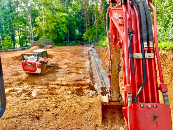 Excavator preparing a landscape area