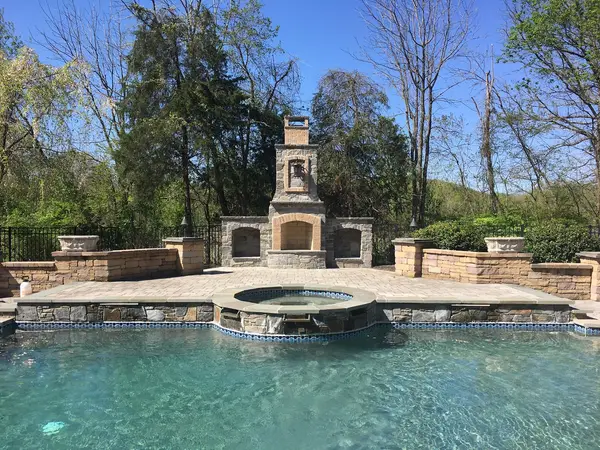 Poolside masonry fireplace