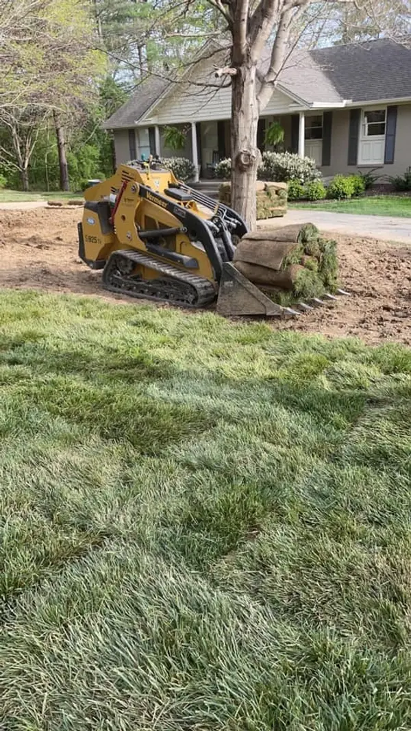 Ground preparation beside a house