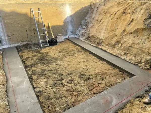 Concrete and foundation-edge preparation in progress