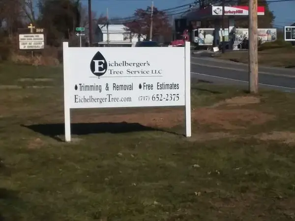 Eichelbergers Tree Service roadside sign with phone number
