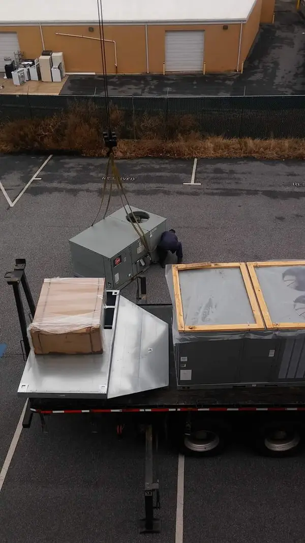 Commercial rooftop HVAC equipment prepared for installation