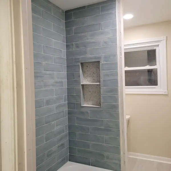 Tiled shower shown on the Joshua Myers profile