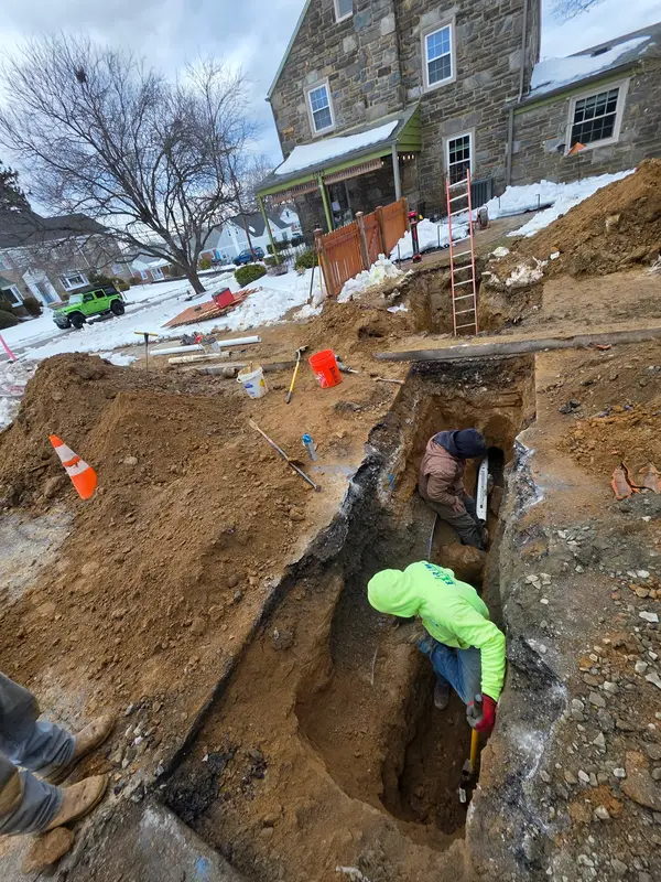 Tight-access underground plumbing work shown on the Bertotti Plumbing profile