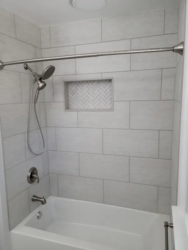 Finished tiled bathtub surround